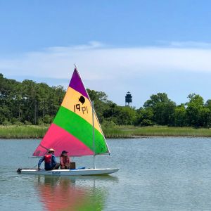 rainbow sunfish passes lighthouse