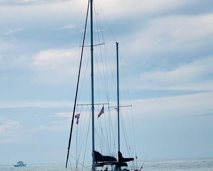 Weasel-at-sunset-sails-furled.jpg