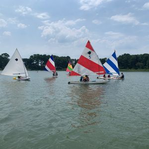 5 boats of campers on the water