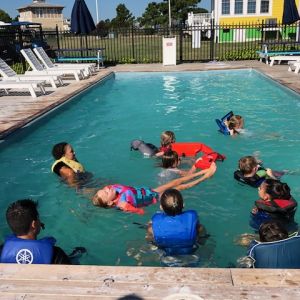 in pool with life vests