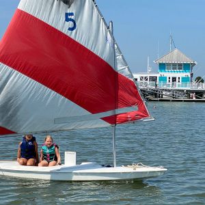 2-girls-under-a-red-and-white-sail-4954.jpg