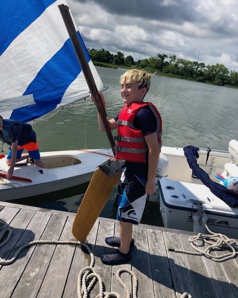 Picture of boy getting ready to sail