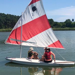 teaching two younger sailors