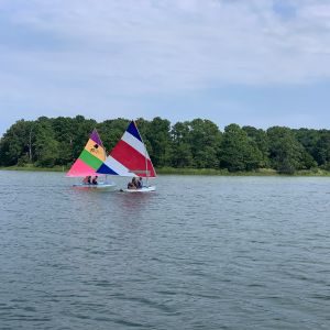 2 boats of campers in a race
