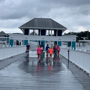 campers-walking-down-the-dock-in-the-rain.jpg