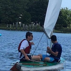 two adult campers sailing